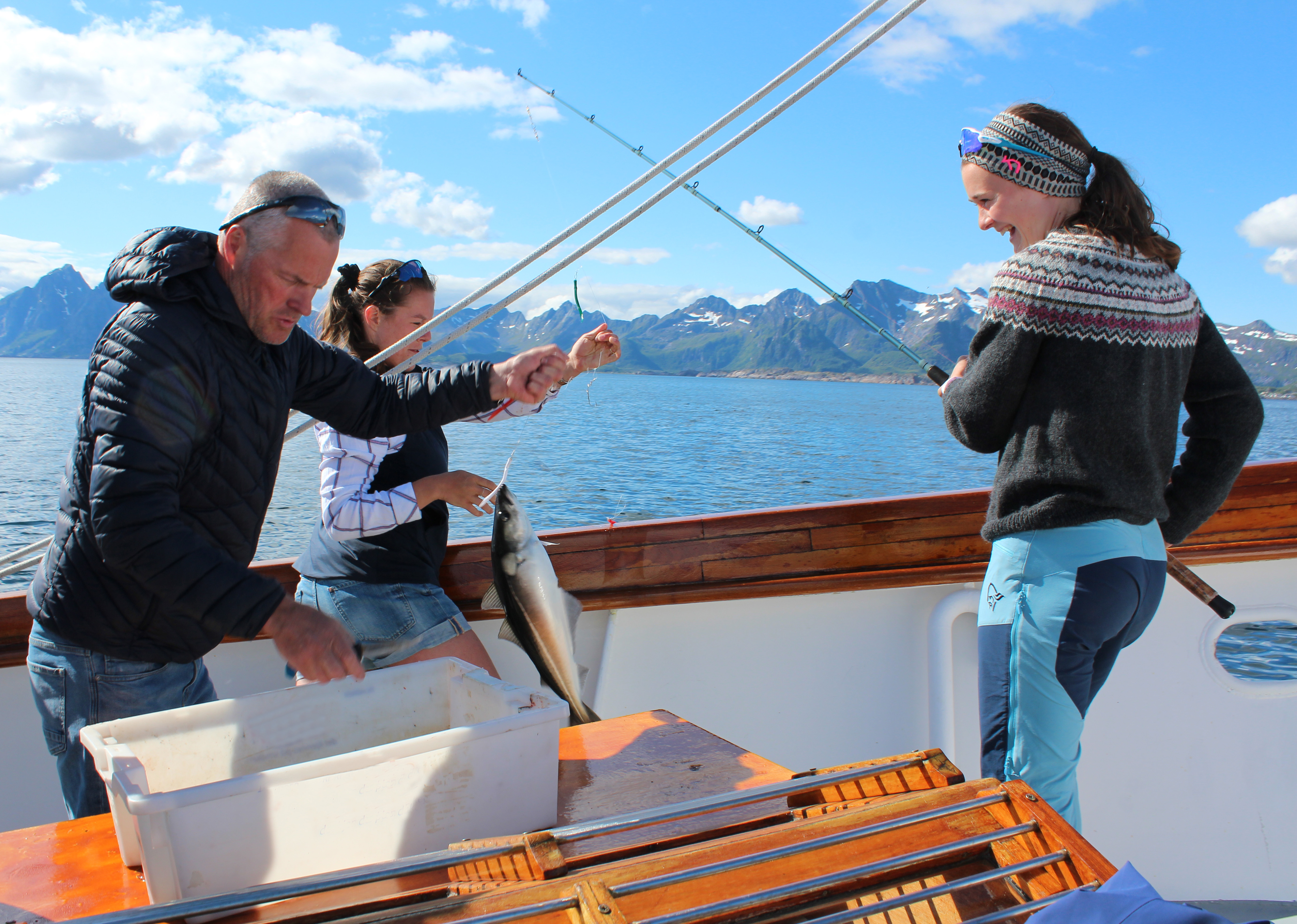 People fishing on board the sailboat Stella Oceana