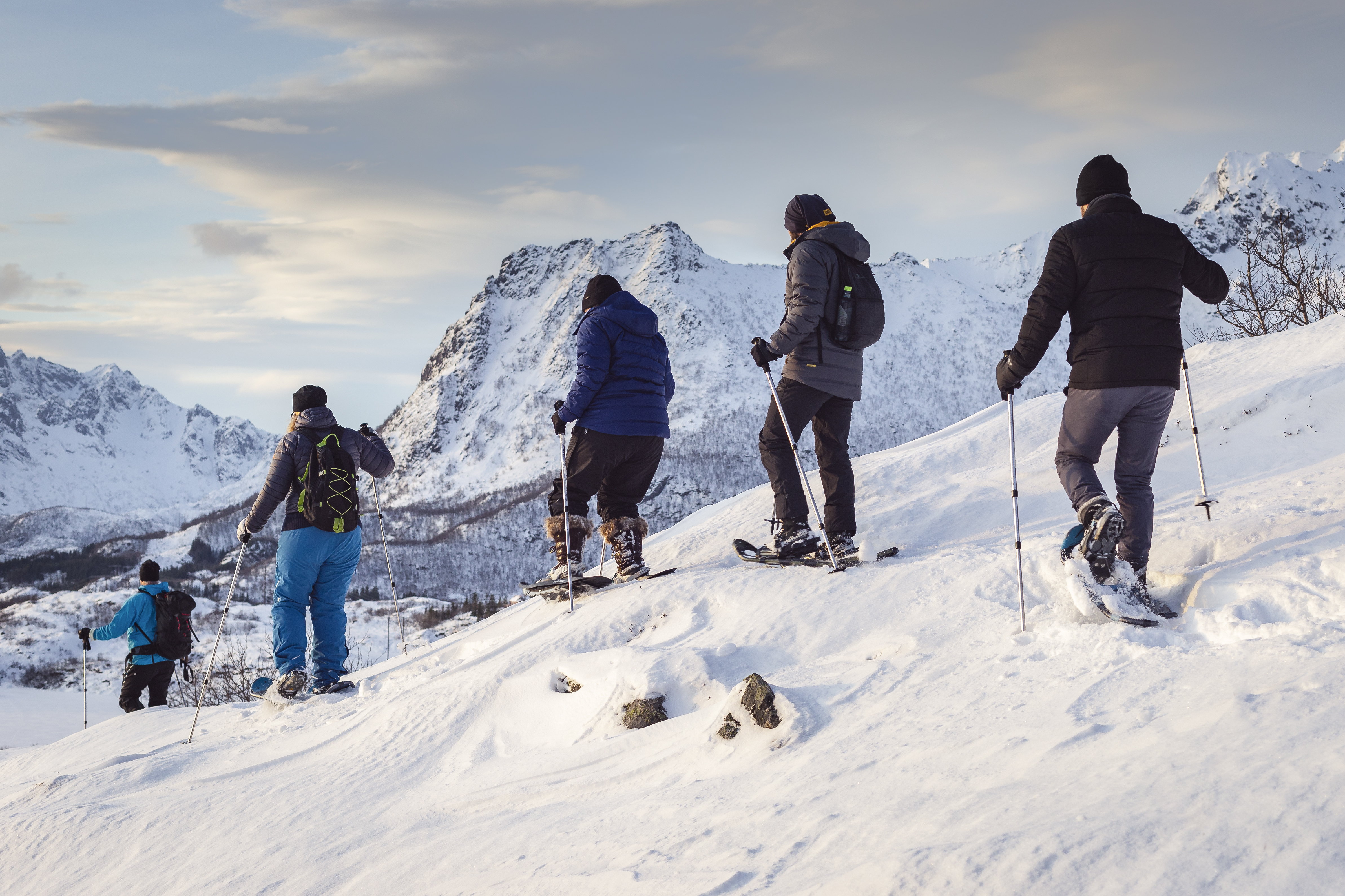 A group of people on nature safari with snowshoes in Svolvær