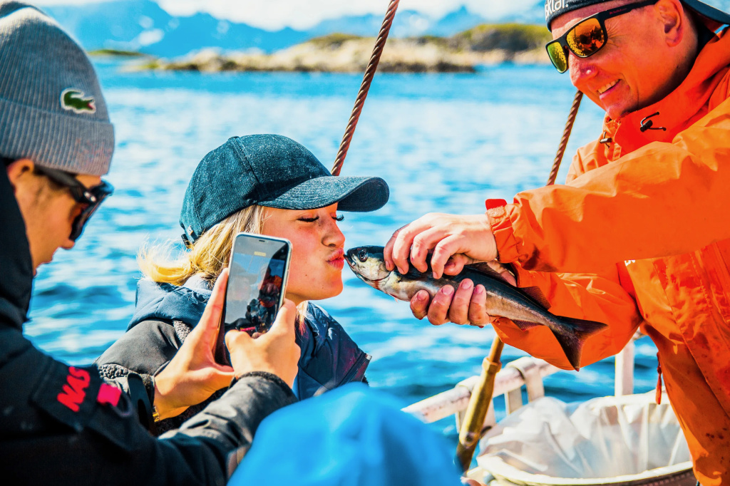 Girl kissing fish.