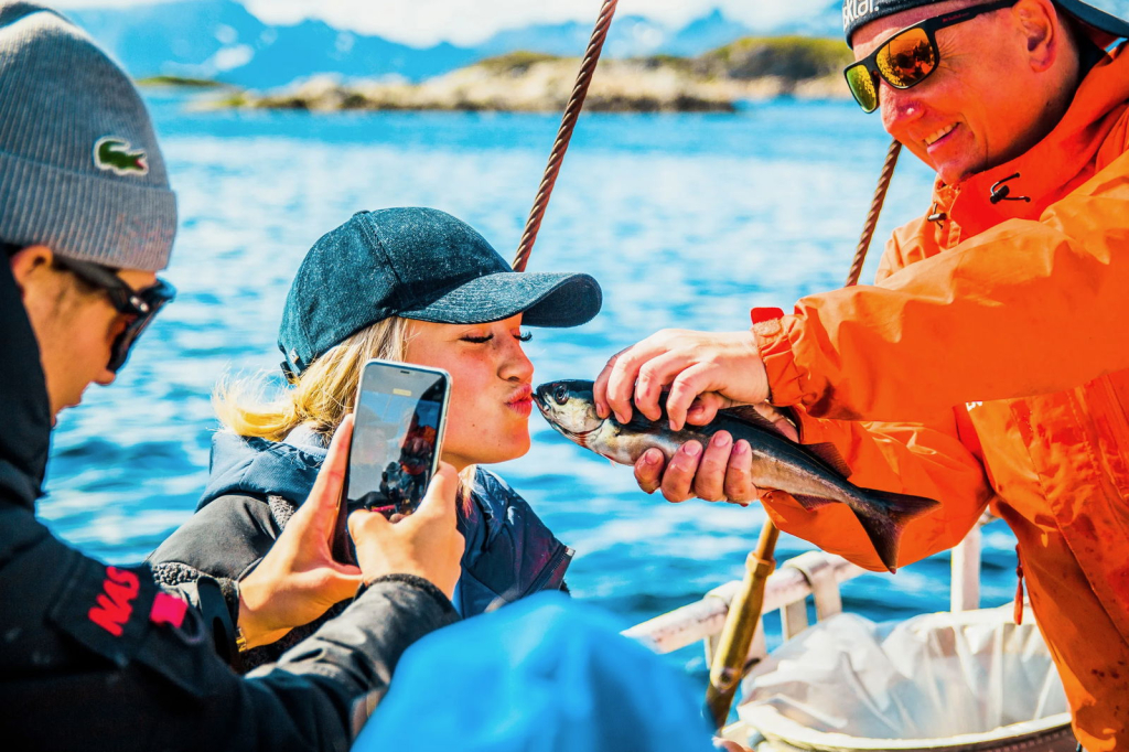 Girl kissing fish.